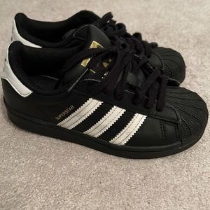 Boys Adidas Superstars.